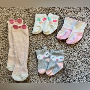3 sets of infant socks and 1 pair of leggings, size 3-6 months.